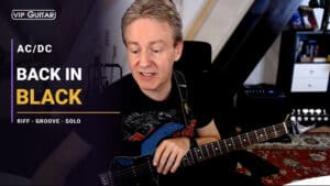 Horst Keller mit E-Gitarre im Back in Black Songtutorial zu AC/DC