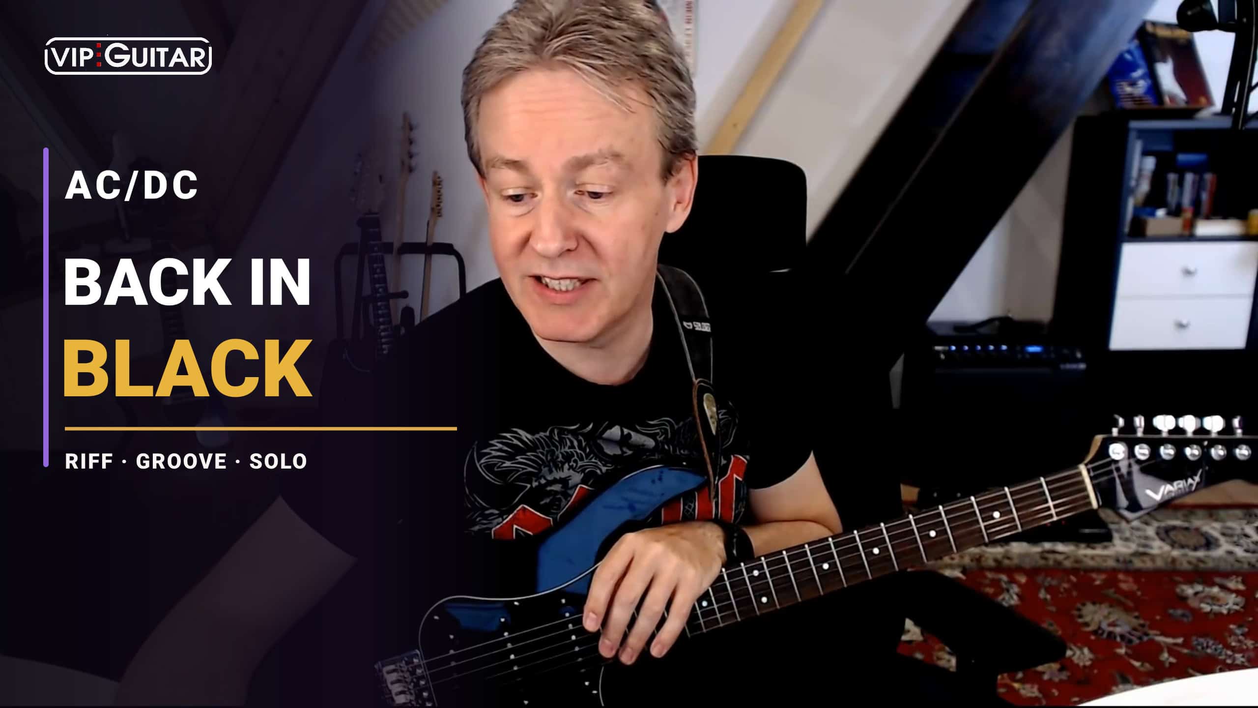 Horst Keller mit E-Gitarre im Back in Black Songtutorial zu AC/DC
